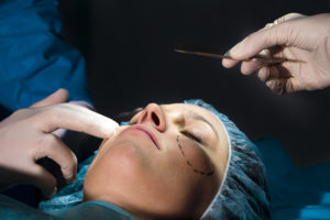 woman in surgical cap getting surgery